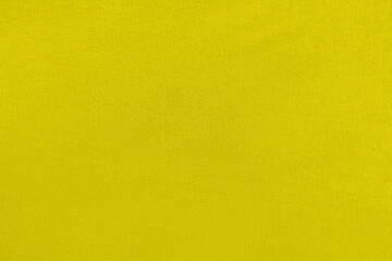 Yellow homogeneous background with a textured surface