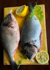 Seasoned fish served on a woden tray