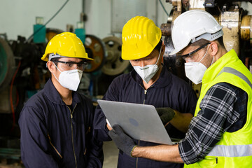 Leader engineer and partnership wearing protective uniform and hardhats in industrial team teamwork.