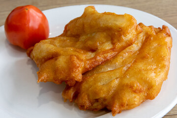 Deep fried battered haddock or halibut fish filets for fish and chips