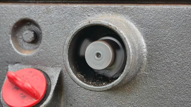 Rotation of the rotor of the motor of the farm walk behind tractor. Walk behind tractor engine. Rotation of the tractor rotor. Tractor diesel engine. Agricultural machinery. Mechanization.