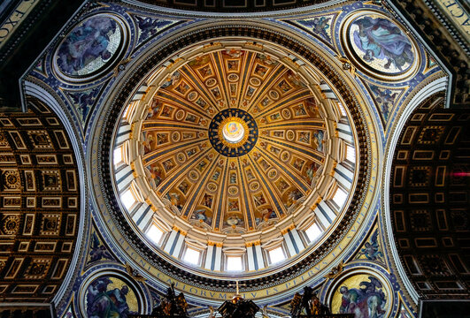 Ceiling dome with art in the st peters church basilica in the vatican city, rome, italy.