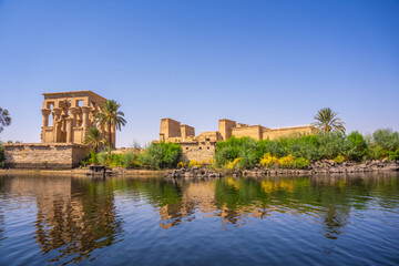 The beautiful temple of Philae and the Greco-Roman buildings seen from the Nile river, a temple...