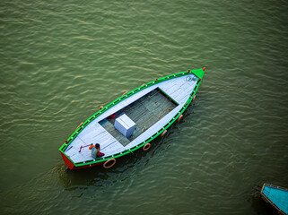 Fototapeta na wymiar Aerial view of a boatman boating on the River ganges at varanasi