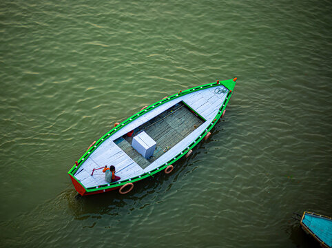 Aerial view of a boatman boating on the River  ganges at varanasi