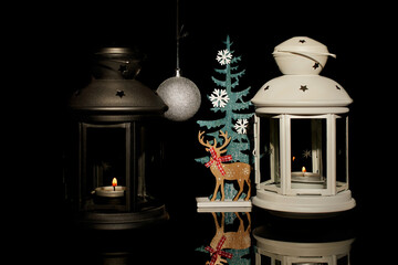 Christmas lanterns with Christmas decorations on a black background