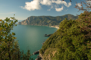 Fototapeta na wymiar Fantastic view on Ligurian Coast- - mountains and speed boat in ewater of Mediterranean Sea
