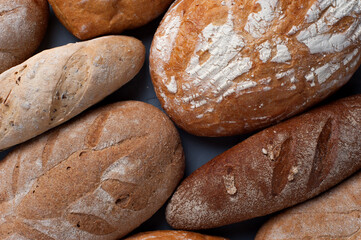 Flat lay bread background. Freshly baked assortment of bread.