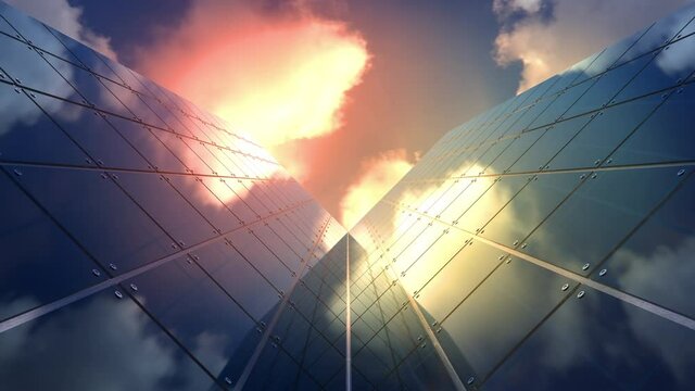 Colorful cloudscape time lapse over modern office buildings in a downtown business center located in a financial district of the urban city