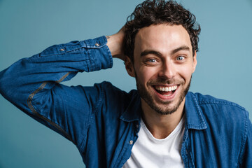 Happy handsome guy laughing and looking at camera