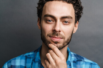 Fototapeta premium Unshaven pleased guy posing and looking at camera