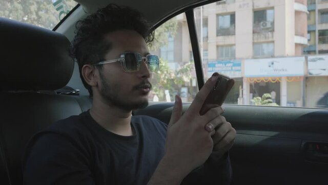 Vivaan seating in-cab texting on phone black t-shirt India Mumbai