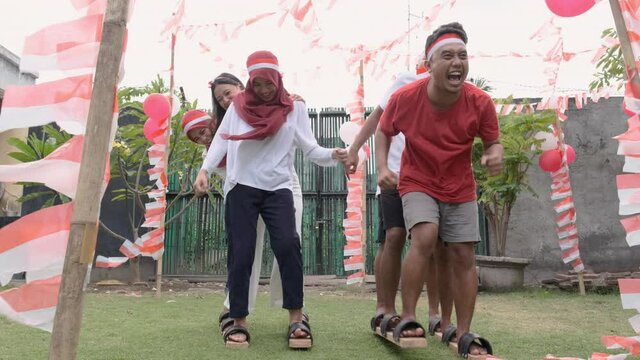 participants were happy at traditional bakiak race in celebration of Indonesia's independence anniversary