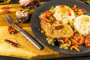 Food and drink concept. Roasted pork chop and rice as main course. Pork with rice and sausage.