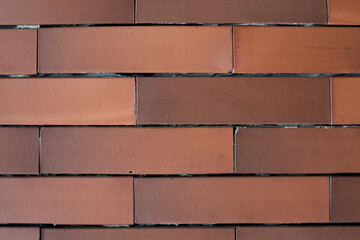 Red brick wall background. New wall with grey cement.