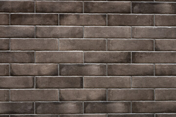 Brown brick wall background. new wall with grey cement.