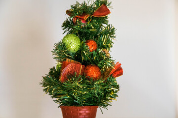 small christmas tree decoration in a white background