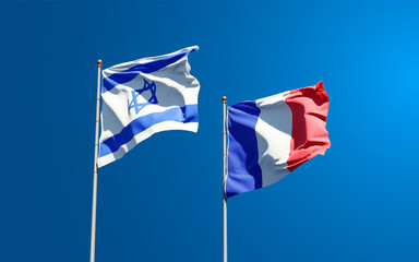 Beautiful national state flags of Israel and France together at the sky background. 3D artwork concept.