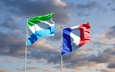 Beautiful national state flags of Sierra Leone and France together at the sky background. 3D artwork concept.