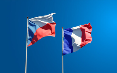 Beautiful national state flags of Czech Republic and France together at the sky background. 3D artwork concept.