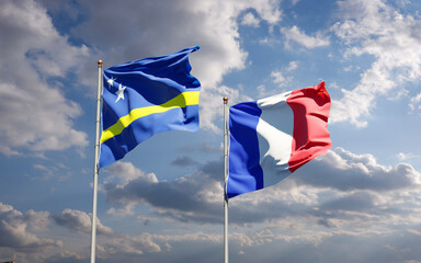 Beautiful national state flags of Curacao and France together at the sky background. 3D artwork concept.