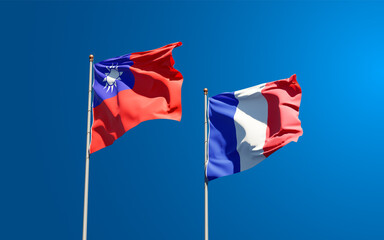 Beautiful national state flags of Republic of China and France together at the sky background. 3D artwork concept.