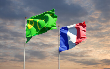 Beautiful national state flags of Cocos Islands and France together at the sky background. 3D artwork concept.