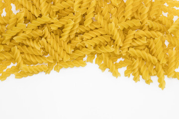 Tasty Fusilli pasta background. Healthy food textures