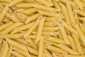Penne pasta background. Healthy food textures and details for a restaurant