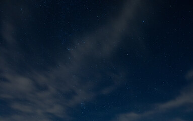 Fototapeta na wymiar Light clouds with stars behind