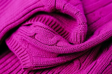 Fototapeta na wymiar Magenta color background. Full frame shot of knitted fabric