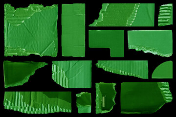 Close up of a green vintage torn sheet of carton. Cardboard paper texture with a blank background. Empty papercraft surface. Isolated shape and element.