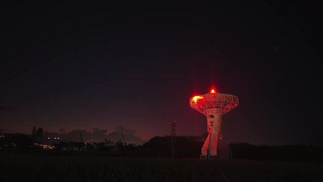 Red parabol waiting for a signal from sky