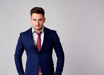 Young man poses head-on with elegance