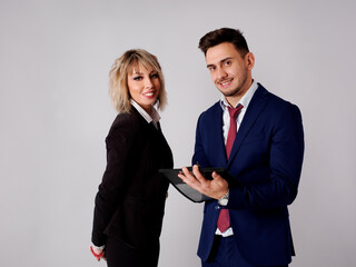 Business personnel are shown smiling and with positive and confident aptitude