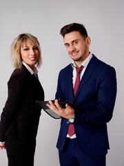 Business personnel are shown smiling and with positive and confident aptitude