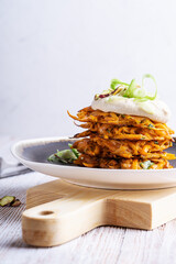Sweet potato fritters.with hummus and pistachios