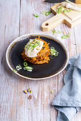 Sweet potato fritters.with hummus and pistachios