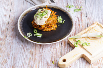 Sweet potato fritters.with hummus and pistachios