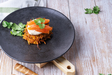 Sweet potato fritters.with hummus and smoked salmon