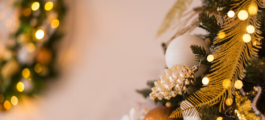 Gold and white Christmas background, greeting card, view with a decorated Christmas tree and space for text