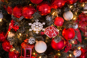 closeup of red decorations on the Christmas tree