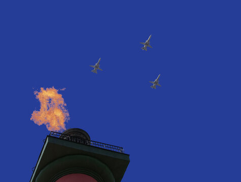 Russian military aircraft in the blue sky with rastral columns of St. Petersburg
