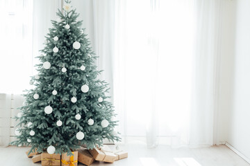 Door opening into a beautiful living room decorated for Christmas