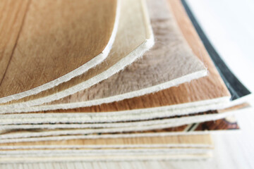 Linoleum cut into pieces. Samples of flooring in a bundle.