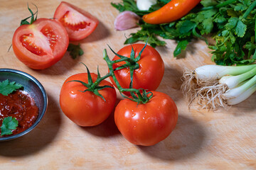 red delicious tomatoes with herbs vegetarian food