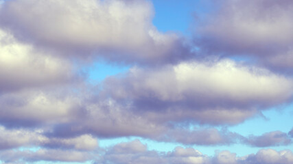Dark clouds against a blue sky