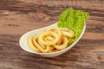 Roasted squid rings with salad