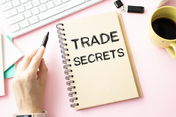 Trade Secrets. Tablet device on a wooden table.