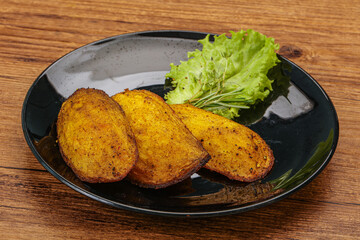 Baked potato with herbs and spices